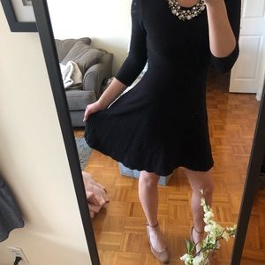 Quarter length sleeve black dress